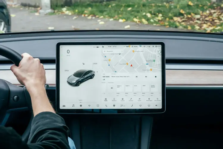Road trip navigation setup with map on car screen.