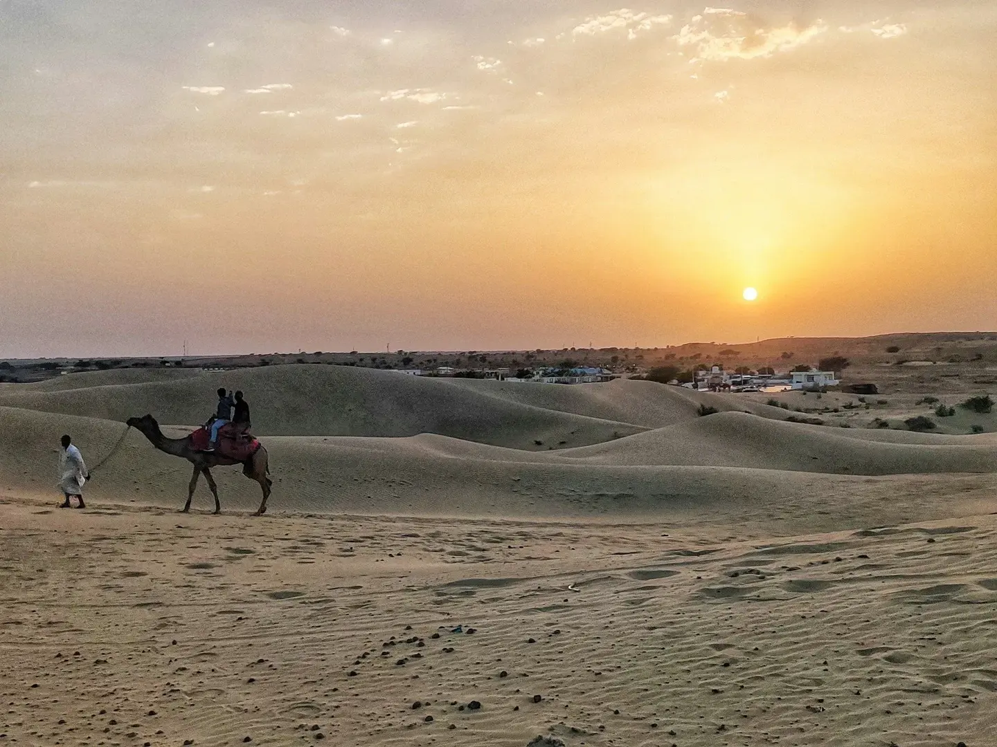 Sunset view of Jaisalmer city and surrounding desert landscape in Rajasthan.
