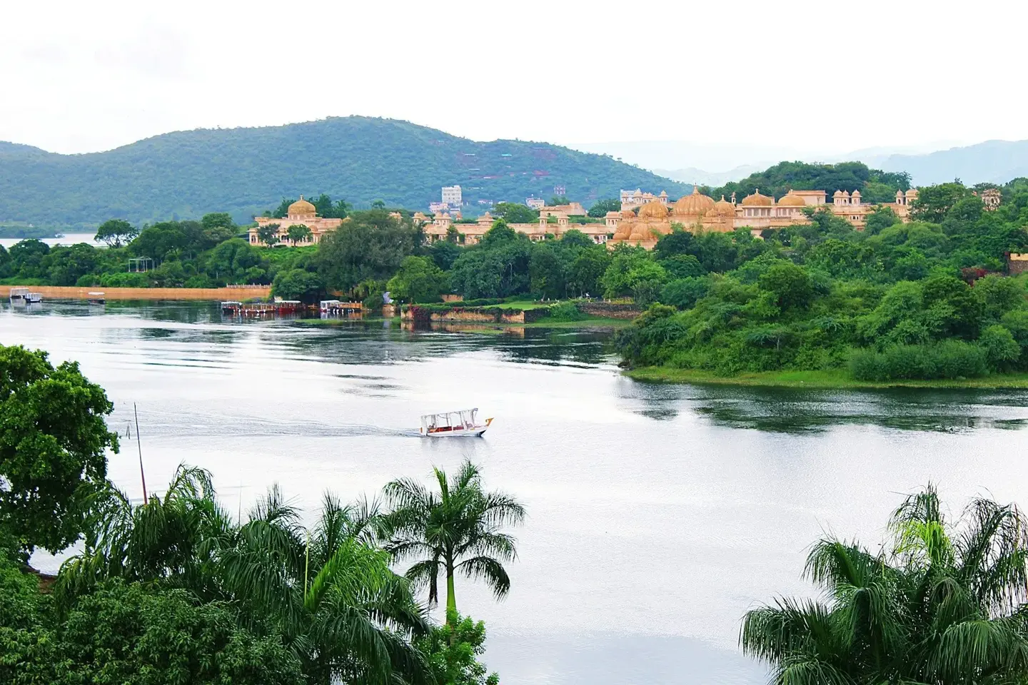 Arrival view of Udaipur city with Lake Pichola and Aravalli hills during Surat to Jaisalmer road trip.